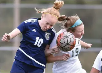  ?? Dan Watson/The Signal (See additional photos on signalscv.com) ?? (Above) West Ranch’s Morgan Gale (10) and Canyon’s Emily Guluzza (19) head a pass at West Ranch on Friday. (Below) West Ranch’s Amanda Baumgartne­r (3), center, celebrates her goal against Canyon with teammates Leanne Kane (20) and Allyson Snyder (13) in the first half at West Ranch on Friday.