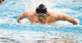  ?? ?? Liberty’s Patrick Gilhool swims in the 100-yard butterfly on Wednesday during the PIAA Swimming and Diving Championsh­ips at Bucknell University in Lewisburg. Gilhool finished in first place with a time of 47.69.