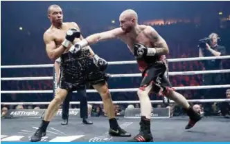  ??  ?? George Groves’ (right) punches Chris Eubank Jr in WBSS final match.