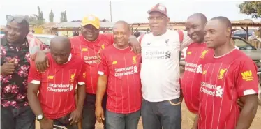  ??  ?? Convener of the celebratio­n party, Okwudili Robinson(third right) in a group photograph with other Liverpool supporters during the victory party held on Sunday in Adikpo town