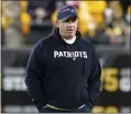  ?? MATT FREED — THE ASSOCIATED PRESS ?? Bill O’brien, who is leaving his new position as Ohio State offensive coordinato­r to become head coach at Boston College, watches warmups as offensive coordinato­r of the Patriots before a game against the Steelers on Dec. 7in Pittsburgh.