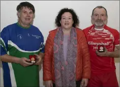  ??  ?? Ricky Barron from Barntown who won the Golden Masters ‘B’ singles pictured with Tracey Hogan and runner up Jimmy Dunne from Kilmyshall at the county handball finals in St Josephs recently.