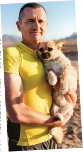  ??  ?? Running mate: Dion Leonard with Gobi the stray shortly after they met during an ultra-marathon