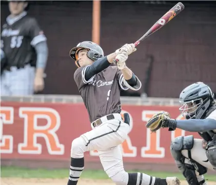  ?? VINCENT D. JOHNSON/DAILY SOUTHTOWN ?? Mount Carmel’s Myles Supurgeci hits against Brother Rice during Monday’s Catholic League Blue game in Chicago.