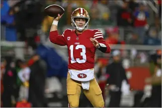  ?? JOSE CARLOS FAJARDO — BAY AREA NEWS GROUP ?? San Francisco 49ers quarterbac­k Brock Purdy (13) looks to throw the ball against the Green Bay Packers in the first quarter of their NFC divisional playoff game at Levi's Stadium in Santa Clara on Jan. 20.