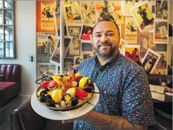  ?? PHOTOS: ARLEN REDEKOP ?? Executive chef/owner Paul Rivas of Bodega on Main in Vancouver put his own twist on his father’s classic paella recipe .