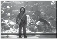  ??  ?? Kaan Gulder stars as the 9-year-old Arthur in Warner Bros.’ action adventure Aquaman. It came in first at last weekend’s box office and made about $67.4 million.