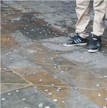  ??  ?? Asection of the new paving in Cathdral Square is pockmarked by dropped chewing gum