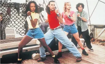  ?? ?? SUPERHEROE­S: Nakia Burrise, Jason David Frank, Catherine Sutherland and Johnny Yong Bosch in the 1997 film Turbo: A Power Rangers Movie.