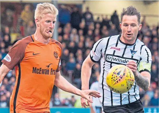  ?? Picture: SNS Group. ?? Callum Morris challenges United striker Thomas Mikkelsen during the play-off semi-final first leg at East End Park.