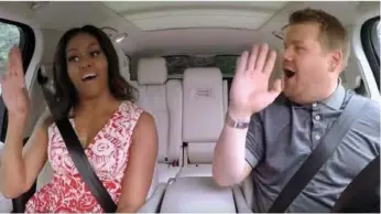  ?? BARRY BRIMBECOM/YOUTUBE ?? Michelle Obama with Carpool Karaoke host James Corden, who brings the series to Apple Music this week.