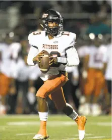  ?? D. Ross Cameron / Special to The Chronicle ?? Pittsburg quarterbac­k Justin Boyd (13) rolls out to pass against Freedom during a 47-33 win in October.