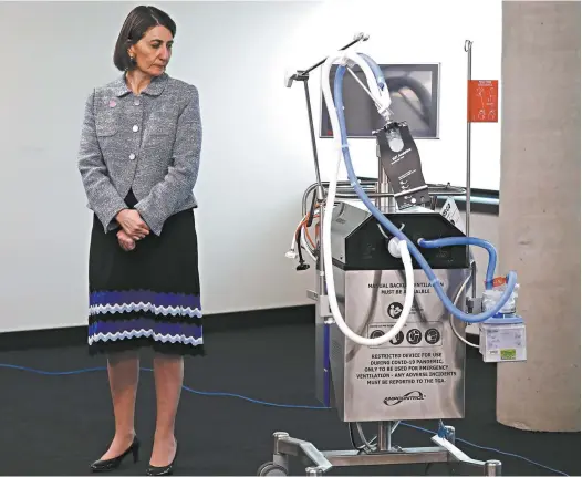  ?? Ryan Pierse / Getty Images News ?? NSW Premier Gladys Berejiklia­n inspects a locally built ventilator.