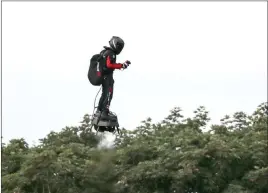  ?? Steve Parsons The Associated Press ?? French inventor Franky Zapata flies near Dover, England, on Sunday during his hoverboard crossing of the English Channel. His journey took 22 minutes.