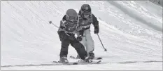  ?? COLIN CHISHOLM ?? Jack Hilliard, left, and Jack Williams cross the finish line during the 2018 Cranberry Cup at Ski Martock.