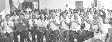  ??  ?? Loretto (seated middle) with members of Warisan Penampang’s Wira and Wanita divisions.