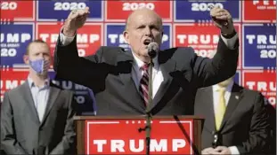  ?? PRESIDENT John Minchillo Associated Press ?? Trump has f iled still more lawsuits — in Arizona and Georgia — as Rudy Giuliani, pictured on Nov. 7, again advanced the blatant f iction that the president won in a landslide.