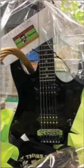  ??  ?? Enter to win this Ibanez RG guitar basket at Ridley Township library.