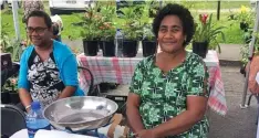  ??  ?? Seruwaia Kabukabu, (right)selling at a ROC market event selling mushrooms.