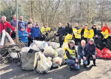  ??  ?? Big effort The 3rd East Kilbride Scouts Group cleaned up in Kittoch Woods as part of a national campaign