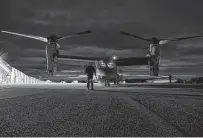  ?? Lance Cpl. Elias E. Pimentel III / U.S. Marine Corps ?? U.S. Marines inspect a MV-22B Osprey on Wednesday before a flight during the Cold Response exercise in Norway.