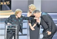  ??  ?? (From left) Betty White, Kate McKinnon, and Alec Baldwin speak onstage. Betty was honoured for her more than 80 years in showbiz.