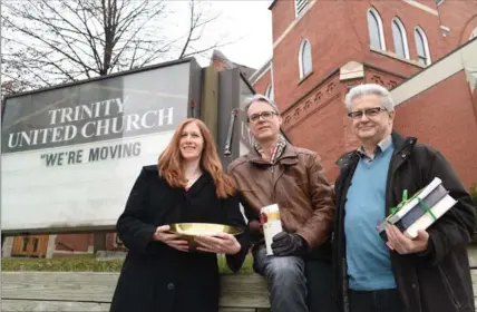  ?? PETER LEE, RECORD STAFF ?? Katherine Bitzer, left, Keith Summers, centre and Bill Bruce stand outside Trinity United Church in downtown Kitchener on Thursday. The congregati­on is vacating the building and will worship in the chapel at St. Matthews Lutheran Church.