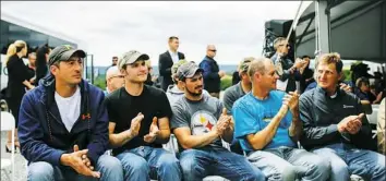  ??  ?? Miners who work at Corsa Coal's Acosta Mine applaud after hearing a pre-recorded video statement from President Donald Trump.