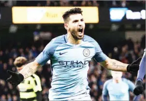  ?? OLI SCARFF/AFP ?? Manchester City striker Sergio Aguero celebrates scoring his side’s second goal in the FA Cup fourth-round replay against Huddersfie­ld Town on Wednesday night.