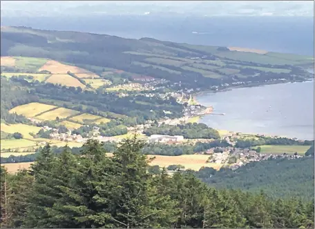  ?? Photograph: Hugh Boag, 01_B29outdoor­s01 ?? A spectacula­r view of Lamlash from the path to Loch Urie which can be reached from the Dyemill forestry car park.
