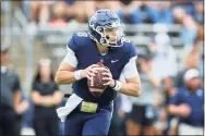  ?? Stew Milne / Associated Press ?? UConn quarterbac­k Steven Krajewski looks for an open receiver against Purdue last Saturday.