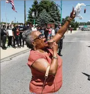  ??  ?? Denise Williams, president of the Springfiel­d NAACP, leads the protesters in a chant during a demonstrat­ion over the summer against racial injustice.