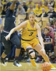  ?? Patterson, AP) (Photo by L.G. ?? Missouri's Sophie Cunningham, right, dribbles around South Carolina's Doniyah Cliney during the first half of Sunday's game in Columbia, Mo.