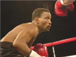  ?? Virginian Pilot/tns ?? Pernell “Sweetpea” Whitaker eyes his opponent Carlos Bojorquez during the second round of their bout at Caeser’s Tahoe Whitaker hurt his shoulder in the second round and was unable to continue after the fourth in April 2001.