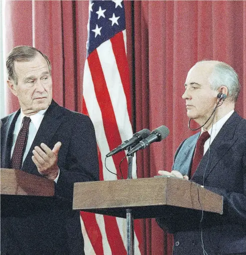  ?? JEROME DELAY / THE ASSOCIATED PRESS FILES ?? President George H.W. Bush, shown here at a 1991 joint news conference with Soviet President Mikhail Gorbachev in Madrid, was skeptical of changes in the former Cold War enemy at first.