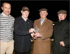  ??  ?? Frank Doyle of Kilrane (right) receiving a long service award from Christy Murphy (Chairman) as Barry Goff and Nicky White look on.