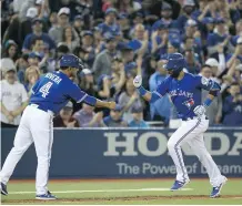  ?? TOM SZCZERBOWS­KI/GETTY IMAGES ?? Fans cheer Jose Bautista during Sunday’s win. Jays’ attendance growth is their biggest ever for a season start.