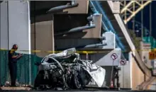  ?? Michael M. Santiago/Post-Gazette ?? Emergency personnel investigat­e the scene of a fatal car accident Saturday on Beaver Avenue in Chateau.