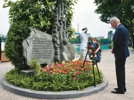  ?? KENNY HOLSTON/THE NEW YORK TIMES ?? In Hanoi, Vietnam, President Joe Biden on Monday visits a memorial to John McCain, his former Senate colleague held prisoner in the Vietnam War.