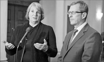  ?? — Photo by Rhonda Hayward/The Telegram ?? Premier Kathy Dunderdale and Finance Minister Jerome Kennedy speak with the media Thursday at a news conference on publicsect­or pension plan reform outside the House of Assembly.