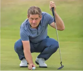  ?? THE ASSOCIATED PRESS ?? Robert Rock waits to putt on the 17th hole at Gullane Golf Club during Friday’s second round of the Scottish Open. Rock shot a 7-under 63 and led after setting the tournament’s 36-hole record at 13-under 127.