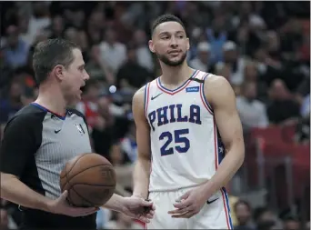  ?? LYNNE SLADKY — ASSOCIATED PRESS ?? Guard Ben Simmons, right, talking with referee David Guthrie, said the 76ers were soft after they were blown out by the Miami Heat Monday, 137-106. With little to offer before the Thursday’s trade deadline it does not look like help is on the way.