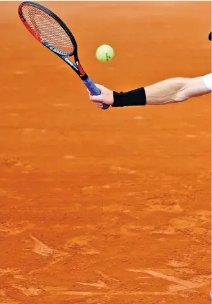  ??  ?? At full stretch: Andy Murray on his way to victory over Slovakia’s Martin Klizan