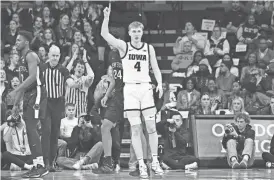  ?? JEFFREY BECKER-USA TODAY SPORTS ?? Iowa guard Josh Dix scored 20 points during the Hawkeyes’ 90-81 win over Penn State on Tuesday. The victory kept Iowa’s NCAA Tournament hopes very much alive.