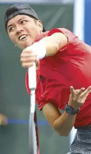  ?? JOEY MENDOZA ?? Taiwan’s Chu Huan Yi hits a smash against Nikola Mektic of Croatia in one of the matches in the opener of the ATP Challenger Philippine Open.