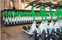  ?? KRISTIAN CARREON FOR THE U-T ?? Lime scooters are stored in a Kearny Mesa warehouse. The company is one of four approved by San Diego to operate in the city.