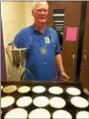  ?? TRACEY READ — THE NEWS-HERALD ?? Carl Hofstetter, a member of the Burton-Middlefiel­d Rotary Club, was among about 75 volunteers at a March pancake breakfast held March 11 at Berkshire High School in Burton.