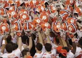  ?? JEFF CHIU - THE ASSOCIATED PRESS ?? FILE - In this Jan. 7, 2019, file photo, Clemson players huddle before the NCAA college football playoff championsh­ip game against Alabama, in Santa Clara, Calif.