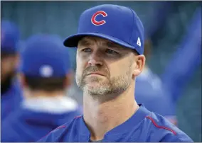  ?? CHARLES REX ARBOGAST - THE ASSOCIATED PRESS ?? FILE - In this Oct. 14, 2016, file photo, Chicago Cubs’ David Ross waits for his turn during batting practice before baseball’s National League Championsh­ip Series against the Los Angeles Dodgers in Chicago.