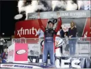  ?? TERRY RENNA — THE ASSOCIATED PRESS ?? William Byron celebrates in Victory Lane after winning the NASCAR Xfinity Series season championsh­ip, Saturday at Homestead-Miami Speedway.